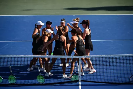 Team Huddle - Tulsa vs SMU in the semifinal round (4/21/23) of the American Athletic Conference Championship, held at the USTA National Campus.