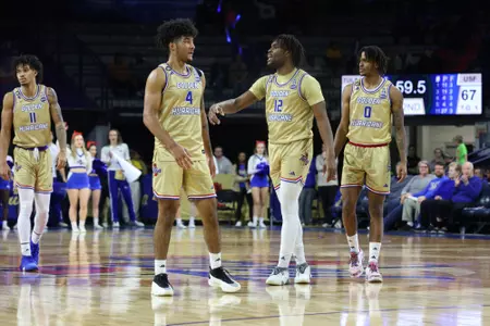 Tulsa Guard #4 PJ Haggerty and Forward #12 Carlous Williams / Tulsa vs #24 South Florida on March 9, 2024 in the Donald W. Reynolds Center