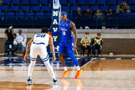 Tylen Riley scans the defense against Rhode Island in the Veterans Classic