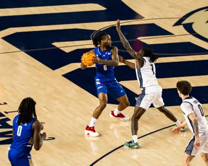 Romad Dean looks to pass against ORU