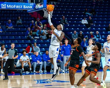 Tylen Riley attempts a layup against East Central