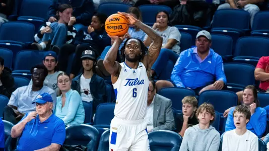 Romad Dean shoots a three-pointer against Austin Peay