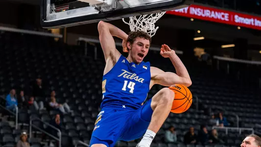 Miles Barnstable celebrates a dunk against San Jose State