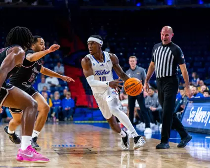 Tylen Riley drives to the basket against Oklahoma Christian 11.3