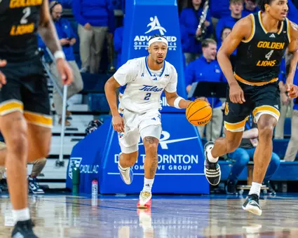Jaylen Lawal dribbles up the court against UAPB