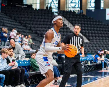 Tylen Riley shoots a three against New Mexico State
