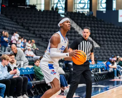 Tylen Riley shoots a three against New Mexico State