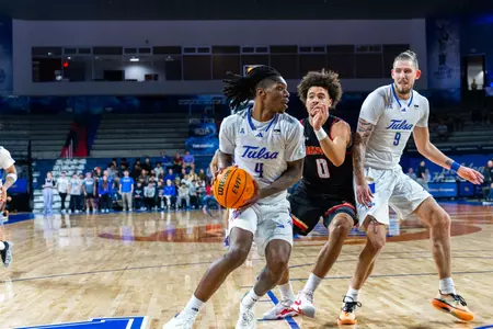 Myles Rigsby in the post against Denver