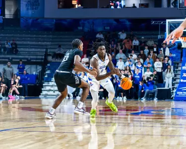 Ade Popoola drives to the hoop against Missouri State