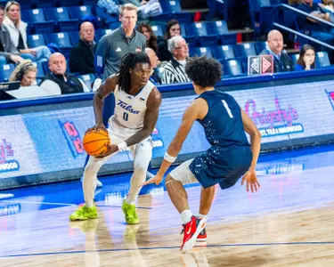 Ade Popoola scans the defense against Manhattan Christian