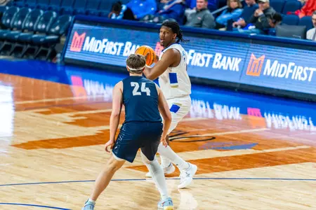 Ian Smikle looks over a defender