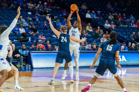 Ian Smikle shoots against Manhattan Christian