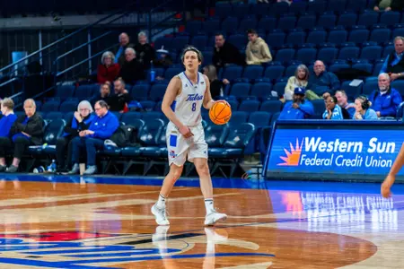 Leon Sifferlin dribbles up the court