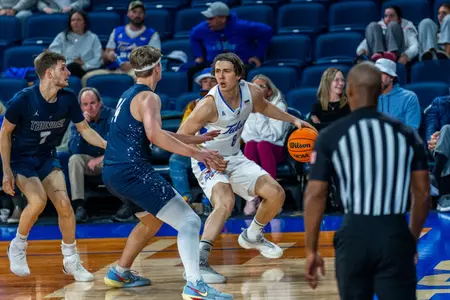Leon Sifferlin dribbles against Manhattan Christian