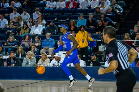 Tylen Riley dribbles up the court at Oral Roberts