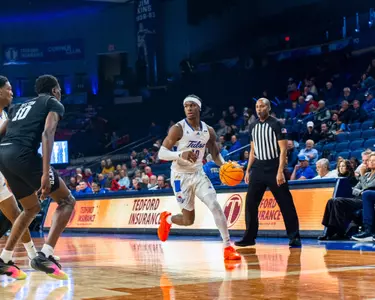 Tylen RIley drives against Missouri State