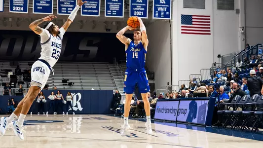 Miles Barnstable shoots a three at Rice