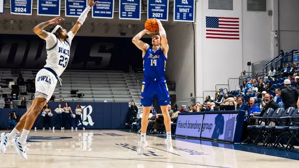 Miles Barnstable shoots a three at Rice