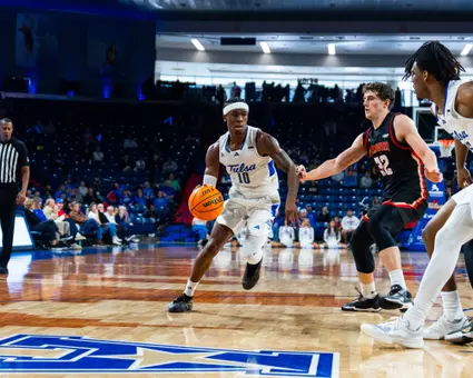 Tylen Riley looks to drive against Denver