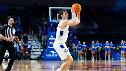 Miles Barnstable shoots a three against North Texas