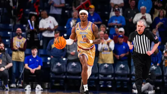 Tylen Riley dribbles up the court against UAB