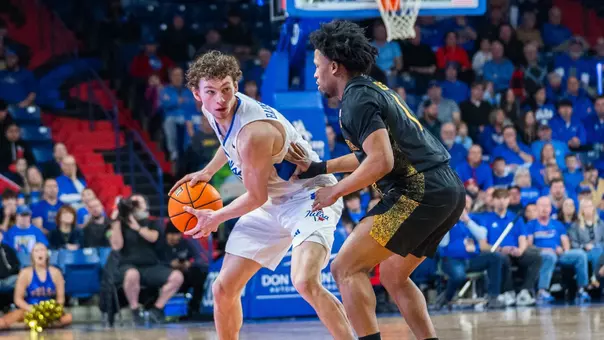 Miles Barnstable is guarded against Wichita State