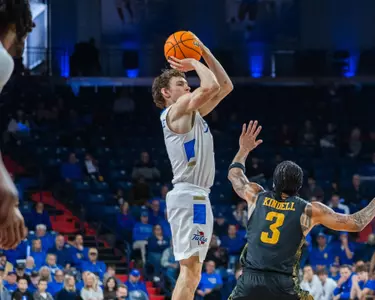 Miles Barnstable shoots a three against Wichita State
