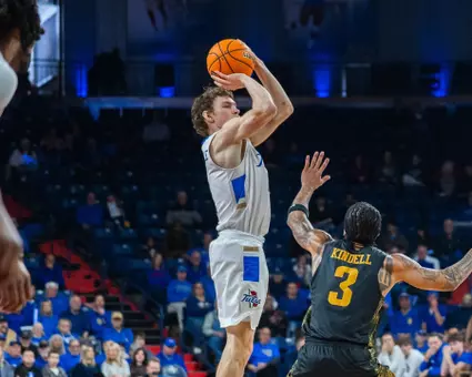 Miles Barnstable shoots a three against Wichita State