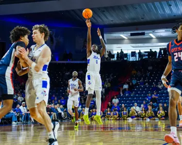 Ade Popoola shoots a three against UTSA