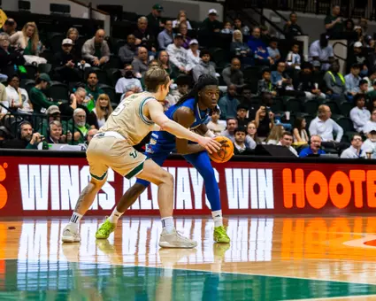 Ade Popoola scans the defense at USF