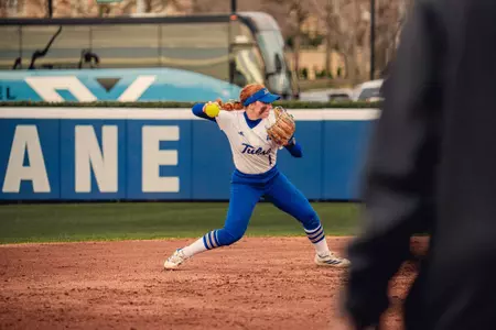 Maci Cole throws over to first base against UTSA