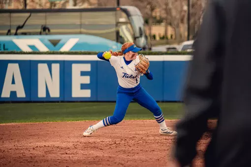 Maci Cole throws over to first base against UTSA
