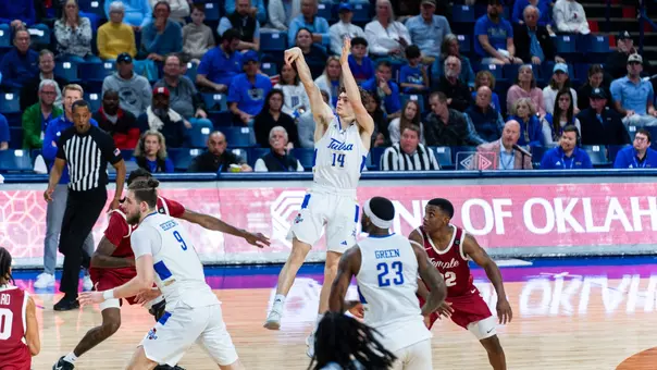 Miles Barnstable attempts a three against Temple