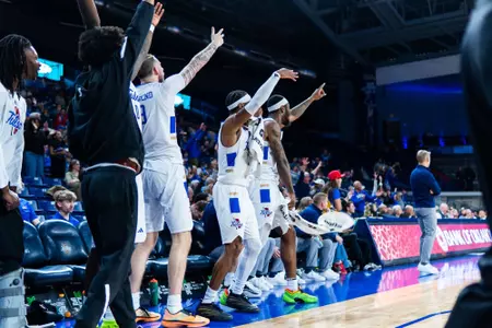 The Tulsa bench celebrates against UTSA