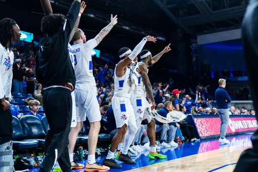 The Tulsa bench celebrates against UTSA