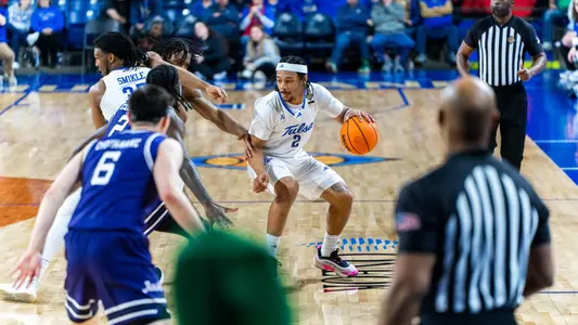 Jaylen Lawal dribbles the ball against SFA