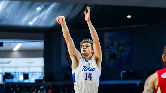 Miles Barnstable shoots a three-pointer against UNLV