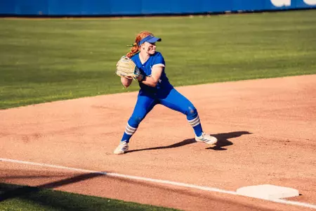 Maci Cole fields a ball at third against Oklahoma State