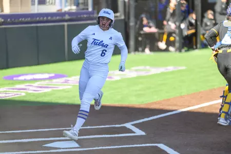 Mackenzy Glenn scores a run against Pitt