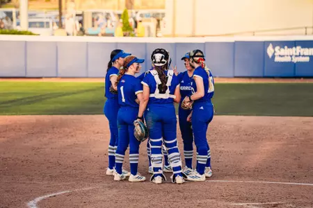 Tulsa huddles in the circle against Oklahoma State