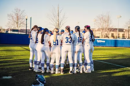 Tulsa softball huddles before facing Nebraska