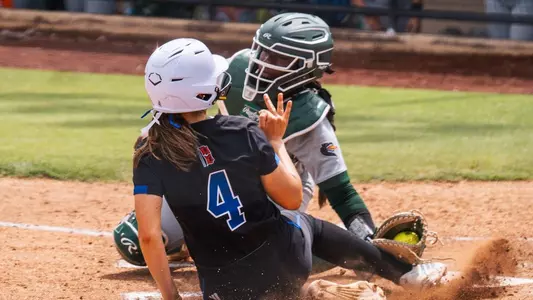 Annika Dill slides into home plate