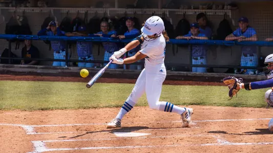 Faith Russell connects on a home run against East Carolina