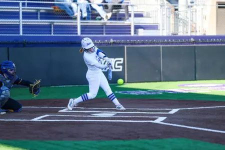 Maci Cole swings the bat