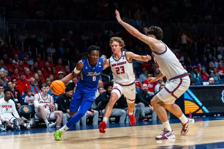 Ade Popoola looks to drive against New Mexico