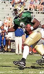 Quarterback Jeff Aaron out steps the Memphis defense to pick up extra yards.