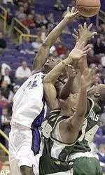 Saint Louis' Kenny Brown out jumps P.J. Arnold and Cedric Davis for the rebound in the first half Tuesday.