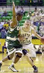 Morris Finley defends against Reggie Kohn during the second half.