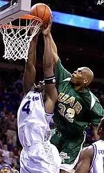 Sidney Ball tries to tap in the rebound over Memphis' Chris Massie.