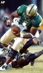 Southern Mississippi defenders try and take down quarterback Darrell Hackney in the second quarter.
